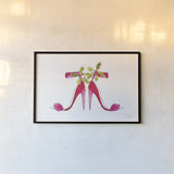 Holiday Stiletto Pair by Mercedes Lopez Charro. shown as a paper print in a black flame. Available as a archival giclee rolled canvas, fine art paper, or poster print. SKU 67982i.
