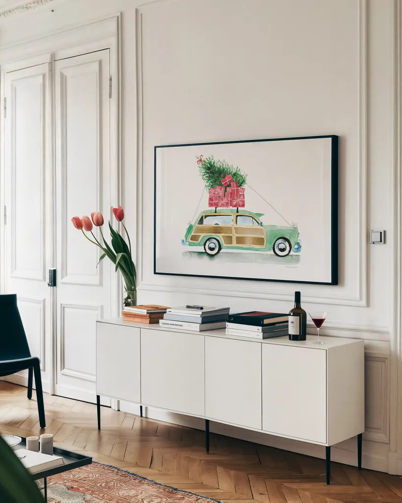 Home for Christmas by Mercedes Lopez Charro. shown as a framed stretched canvas in a living room above a console. Available as a archival giclee rolled canvas, fine art paper, or poster print. SKU 89233i.