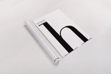 Hooray for H on White by Mercedes Lopez Charro. shown as a rolled paper print. Available as archival giclee rolled canvas, fine art paper, or poster print. SKU 64149h.