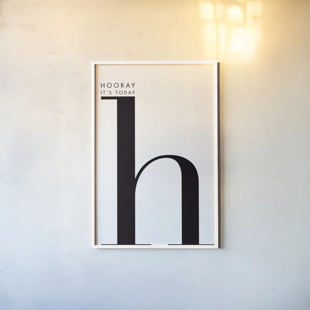 Hooray for H on White by Mercedes Lopez Charro. shown as a paper print in a white frame. Available as a archival giclee rolled canvas, fine art paper, or poster print. SKU 64149h.