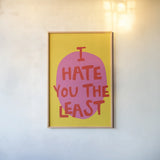 I Hate You The Least by Mercedes Lopez Charro. shown as a paper print in a natural frame. Available as a archival giclee rolled canvas, fine art paper, or poster print. SKU 96973h.