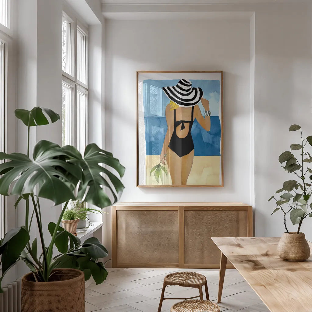 Ipanema Girl One Piece by Mercedes Lopez Charro. shown as a print in a natural wood frame in a dining room. Available as a archival giclee rolled canvas, fine art paper, or poster print. SKU 98158h.