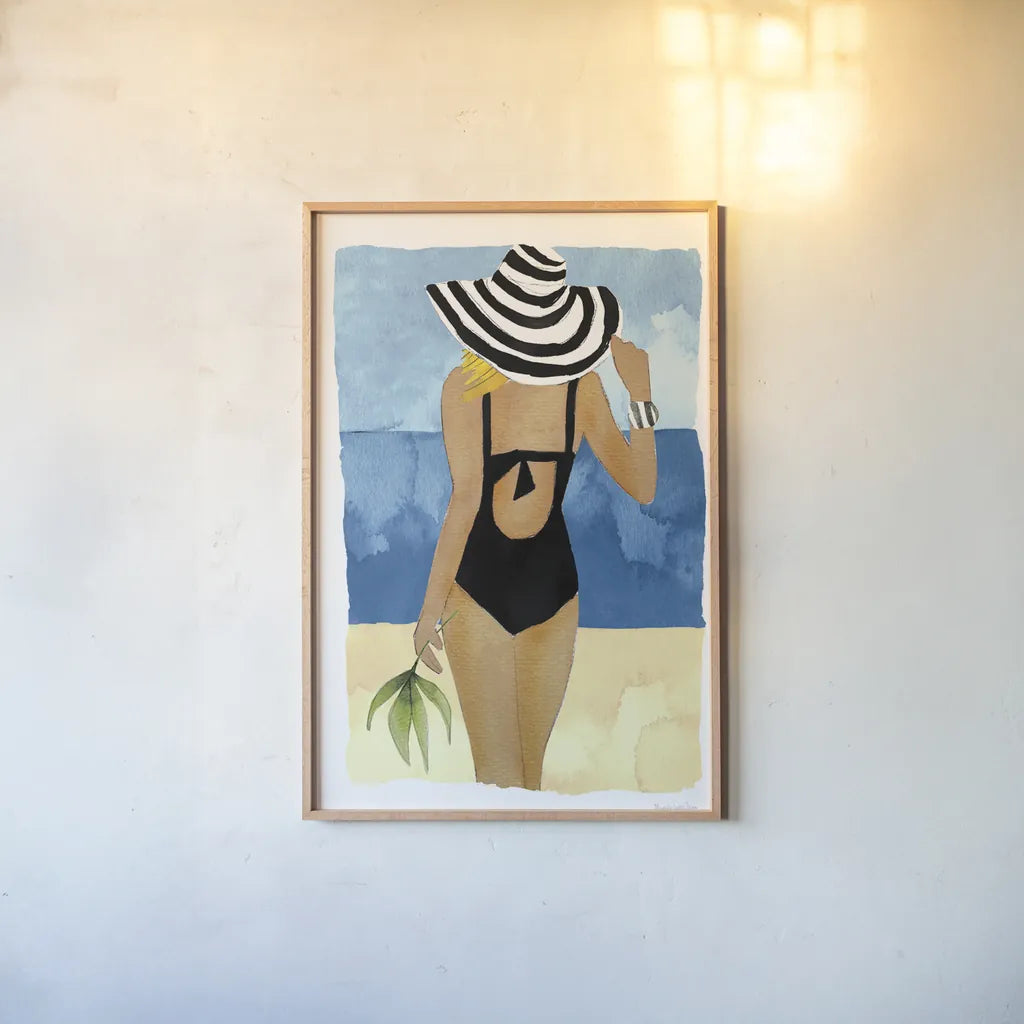 Ipanema Girl One Piece by Mercedes Lopez Charro. shown as a paper print in a natural frame. Available as a archival giclee rolled canvas, fine art paper, or poster print. SKU 98158h.