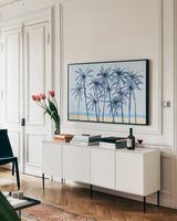 Laguna Palms I by Mercedes Lopez Charro. shown as a framed stretched canvas in a living room above a console. Available as a archival giclee rolled canvas, fine art paper, or poster print. SKU 82209i.
