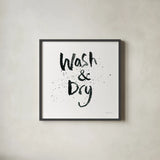Laundry Day I by Mercedes Lopez Charro. Shown in a sleek black glass frame for a contemporary gallery look. Available as an archival giclee rolled canvas, fine art paper, or poster print. SKU 75484a.