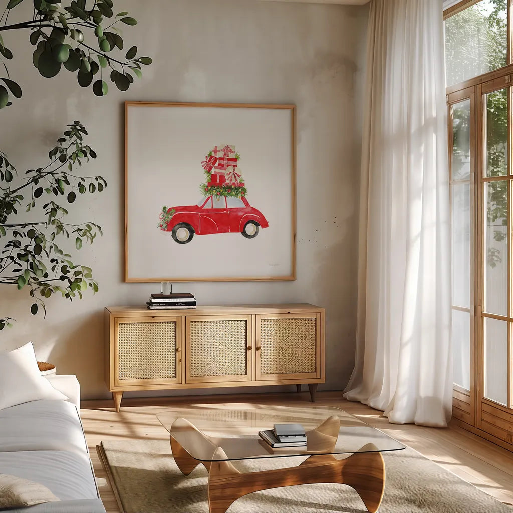 Little Red Holiday Car II by Mercedes Lopez Charro. Shown in a natural wood frame in a cozy modern living room. Available as an archival giclee rolled canvas, fine art paper, or poster print. SKU 67975a.