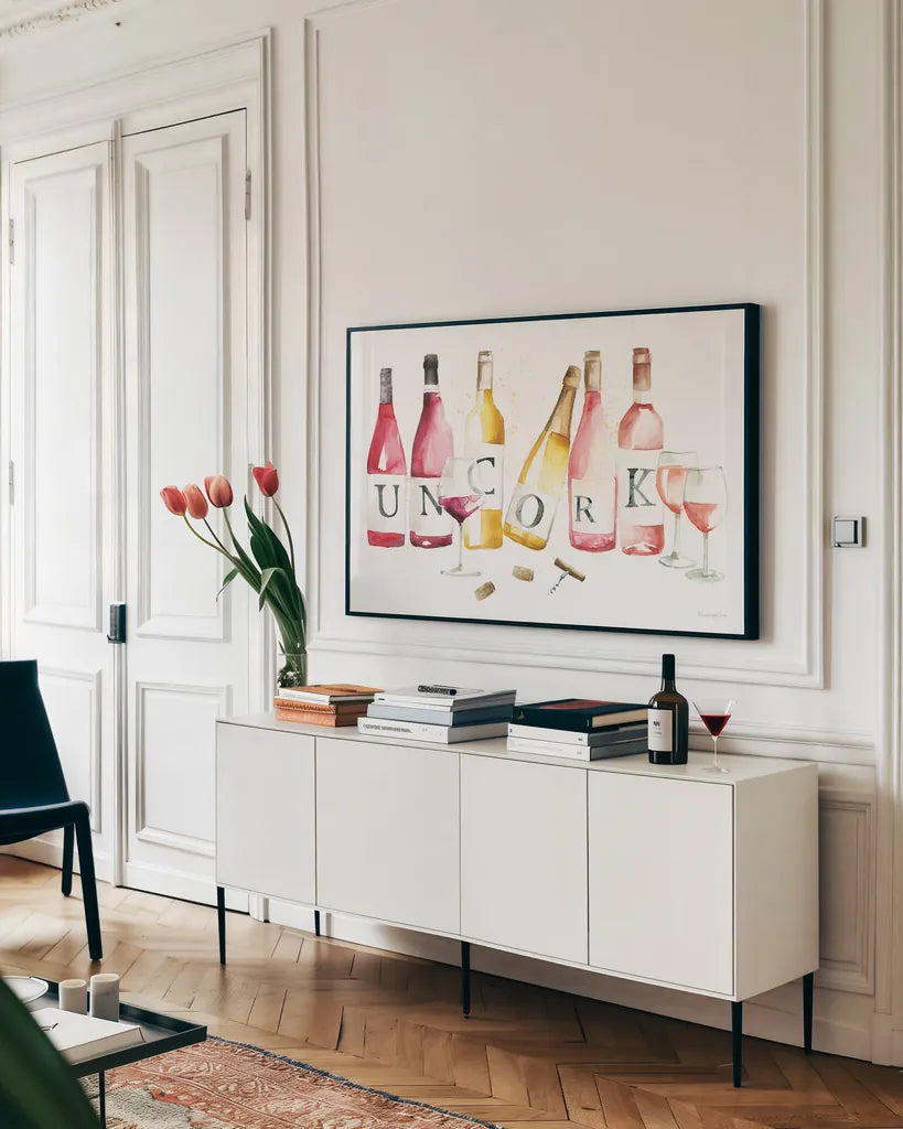 Pop the Cork XI by Mercedes Lopez Charro. shown as a framed stretched canvas in a living room above a console. Available as a archival giclee rolled canvas, fine art paper, or poster print. SKU 74964i.