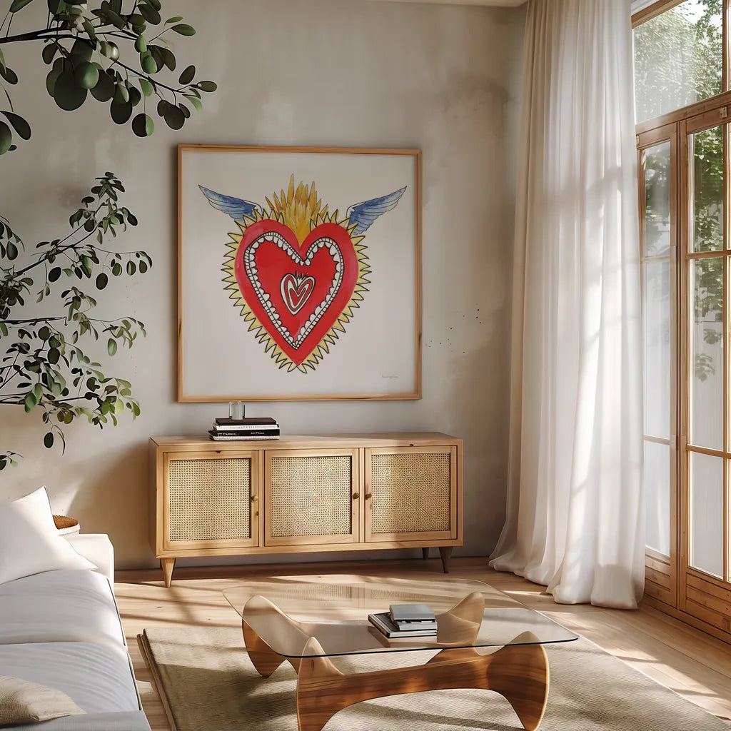 Sacred Heart I by Mercedes Lopez Charro. Shown in a natural wood frame in a cozy modern living room. Available as an archival giclee rolled canvas, fine art paper, or poster print. SKU 82857a.