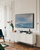 Shining Sea by Mercedes Lopez Charro. shown as a framed stretched canvas in a living room above a console. Available as a archival giclee rolled canvas, fine art paper, or poster print. SKU 67956i.