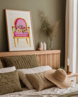 Sitting Pretty I by Mercedes Lopez Charro. shown as a paper print in a natural frame. Available as a archival giclee rolled canvas, fine art paper, or poster print. SKU 72238h.