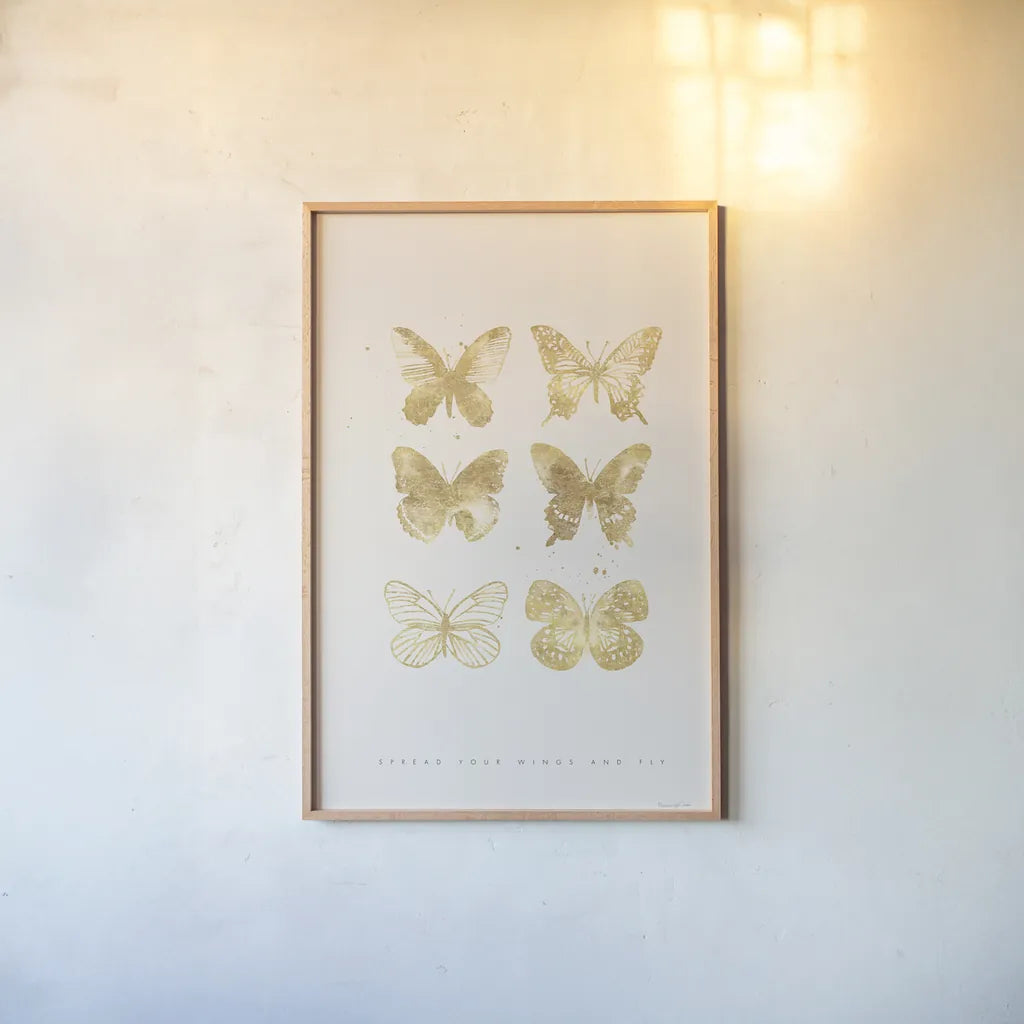 Six Gold Butterflies by Mercedes Lopez Charro. shown as a paper print in a natural frame. Available as a archival giclee rolled canvas, fine art paper, or poster print. SKU 74523h.