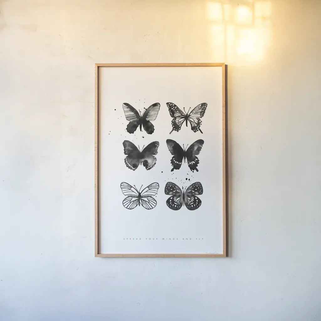 Six Inky Butterflies by Mercedes Lopez Charro. shown as a paper print in a natural frame. Available as a archival giclee rolled canvas, fine art paper, or poster print. SKU 66612h.