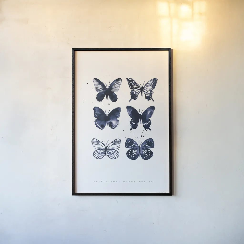 Six Inky Butterflies Blue by Mercedes Lopez Charro. shown as a paper print in a black flame. Available as a archival giclee rolled canvas, fine art paper, or poster print. SKU 68239h.