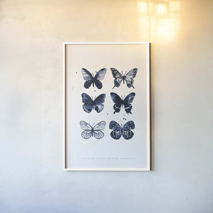 Six Inky Butterflies Blue by Mercedes Lopez Charro. shown as a paper print in a white frame. Available as a archival giclee rolled canvas, fine art paper, or poster print. SKU 68239h.