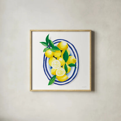 Spanish Lemons I by Mercedes Lopez Charro. Shown in a natural wood glass frame for a timeless modern aesthetic. Available as an archival giclee rolled canvas, fine art paper, or poster print. SKU 66360a.