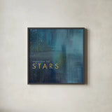 Stars Gold by Mercedes Lopez Charro. Shown in a sleek black glass frame for a contemporary gallery look. Available as an archival giclee rolled canvas, fine art paper, or poster print. SKU 74524a.