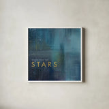 Stars Gold by Mercedes Lopez Charro. Shown in a crisp white glass frame for a clean and minimalist style. Available as an archival giclee rolled canvas, fine art paper, or poster print. SKU 74524a.