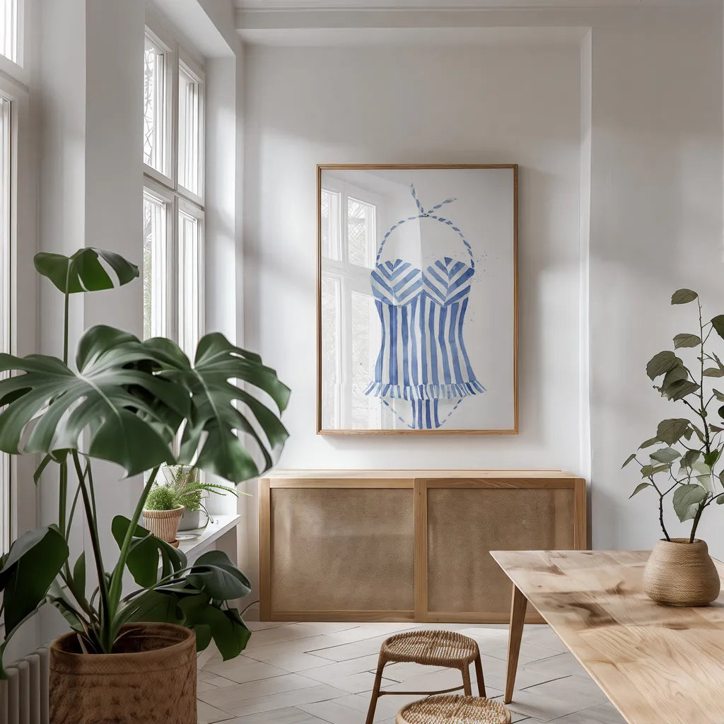 Vintage Swimwear I by Mercedes Lopez Charro. shown as a print in a natural wood frame in a dining room. Available as a archival giclee rolled canvas, fine art paper, or poster print. SKU 66614h.