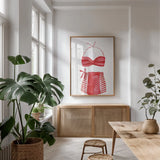 Vintage Swimwear II by Mercedes Lopez Charro. shown as a print in a natural wood frame in a dining room. Available as a archival giclee rolled canvas, fine art paper, or poster print. SKU 66615h.