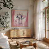 An Arrangement of Pink Flowers by Michael Clark. Shown in a natural wood frame in a cozy modern living room. Available as an archival giclee rolled canvas, fine art paper, or poster print. SKU 8702a.