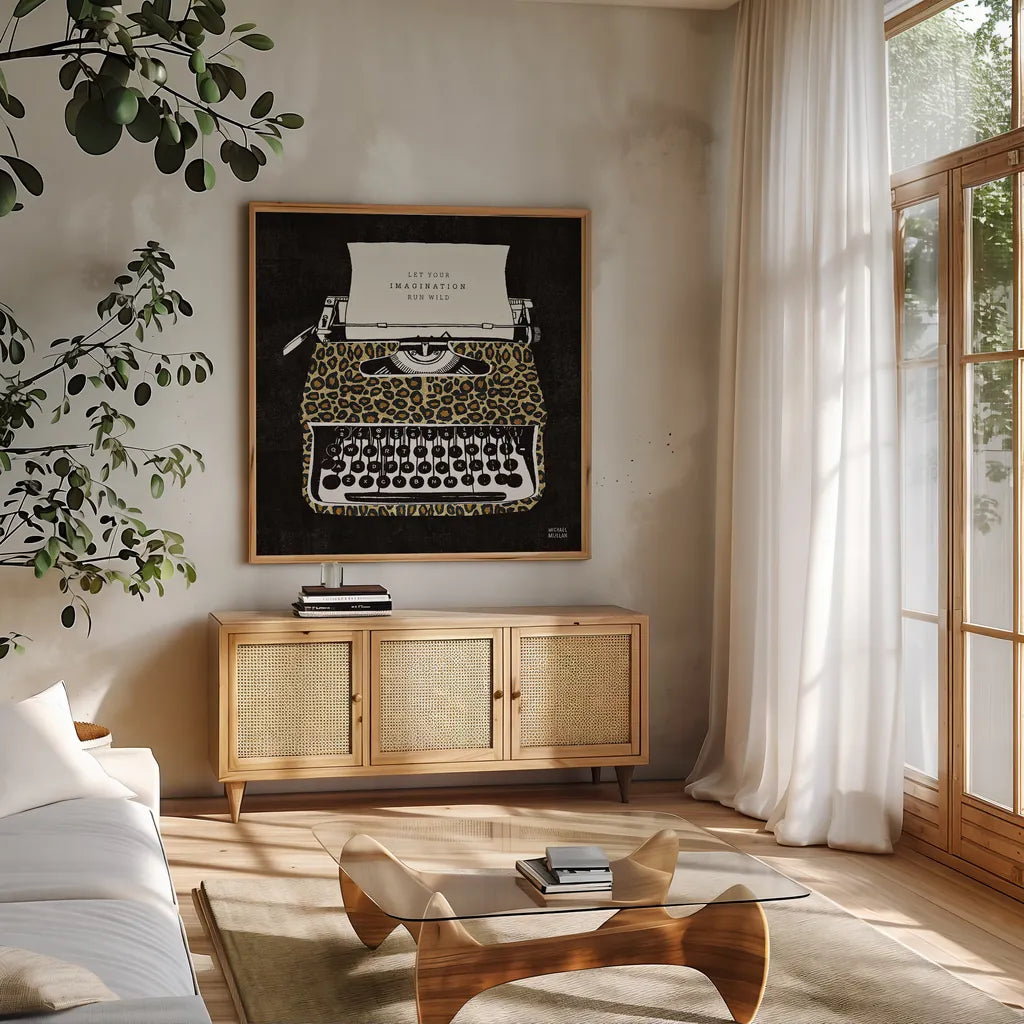 Analog Jungle Typewriter by Michael Mullan. Shown in a natural wood frame in a cozy modern living room. Available as an archival giclee rolled canvas, fine art paper, or poster print. SKU 12375a.
