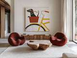 Beach Bums Dachshund Bicycle I by Michael Mullan. Shown as extra-large giant wall art in a modern living room. Available as an archival giclee rolled canvas, fine art paper, or poster print. SKU 23291a.