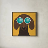 Beach Bums Dachshund I by Michael Mullan. Shown in a sleek black glass frame for a contemporary gallery look. Available as an archival giclee rolled canvas, fine art paper, or poster print. SKU 23289a.