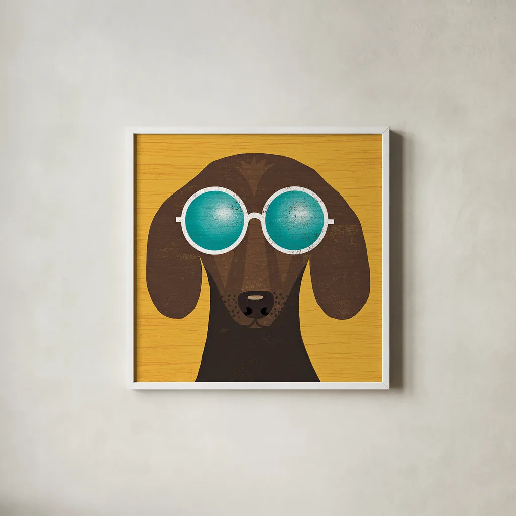 Beach Bums Dachshund I by Michael Mullan. Shown in a crisp white glass frame for a clean and minimalist style. Available as an archival giclee rolled canvas, fine art paper, or poster print. SKU 23289a.