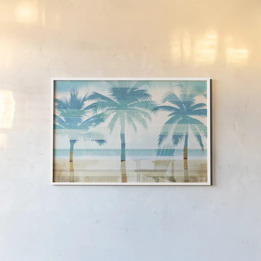 Beachscape Palms with chair by Michael Mullan. shown as a paper print in a white frame. Available as a archival giclee rolled canvas, fine art paper, or poster print. SKU 44889i.
