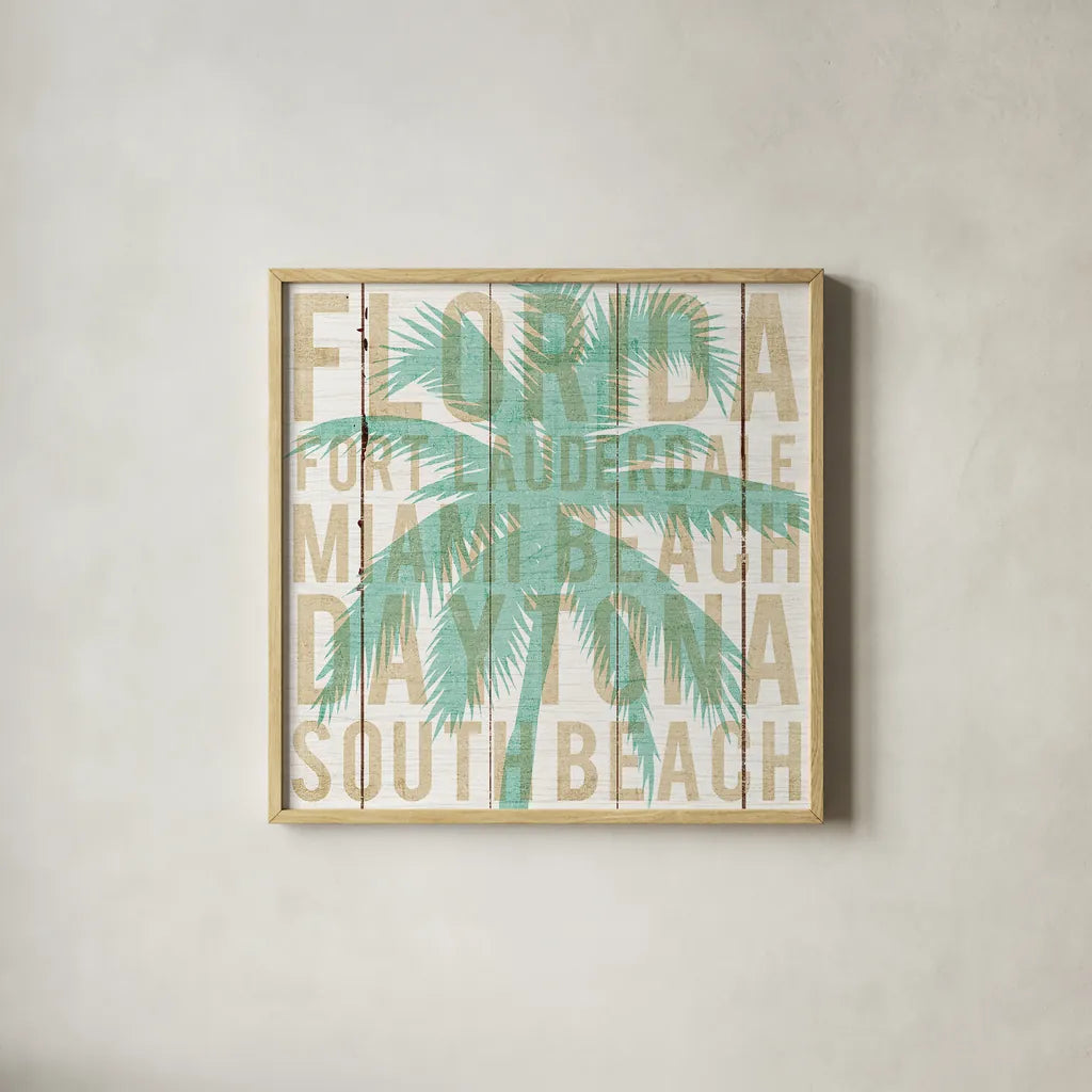 Bon Voyage Florida Palm by Michael Mullan. Shown in a natural wood glass frame for a timeless modern aesthetic. Available as an archival giclee rolled canvas, fine art paper, or poster print. SKU 23165a.