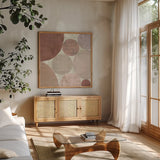 Circulation II v2 Blush by Michael Mullan. Shown in a natural wood frame in a cozy modern living room. Available as an archival giclee rolled canvas, fine art paper, or poster print. SKU 42726a.