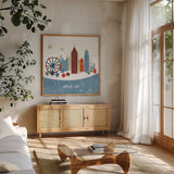 Colorful Atlanta by Michael Mullan. Shown in a natural wood frame in a cozy modern living room. Available as an archival giclee rolled canvas, fine art paper, or poster print. SKU 101637a.