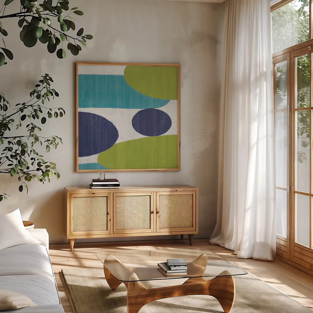 Costa Del Sol I Blue Green by Michael Mullan. Shown in a natural wood frame in a cozy modern living room. Available as an archival giclee rolled canvas, fine art paper, or poster print. SKU 72266a.