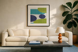 Costa Del Sol I Blue Green by Michael Mullan. Displayed in a glass frame with matte in a clean modern living room. Available as an archival giclee rolled canvas, fine art paper, or poster print. SKU 72266a.