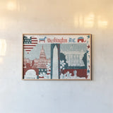 DC Icons by Michael Mullan. shown as a paper print in a natural frame. Available as a archival giclee rolled canvas, fine art paper, or poster print. SKU 50698i.