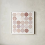 Dots II Square II Blush by Michael Mullan. Shown in a crisp white glass frame for a clean and minimalist style. Available as an archival giclee rolled canvas, fine art paper, or poster print. SKU 42740a.