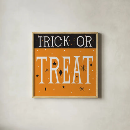 Festive Fright Trick or Treat III by Michael Mullan. Shown in a natural wood glass frame for a timeless modern aesthetic. Available as an archival giclee rolled canvas, fine art paper, or poster print. SKU 67878a.