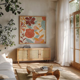 Floral Burst II Warm by Michael Mullan. Shown in a natural wood frame in a cozy modern living room. Available as an archival giclee rolled canvas, fine art paper, or poster print. SKU 61997a.