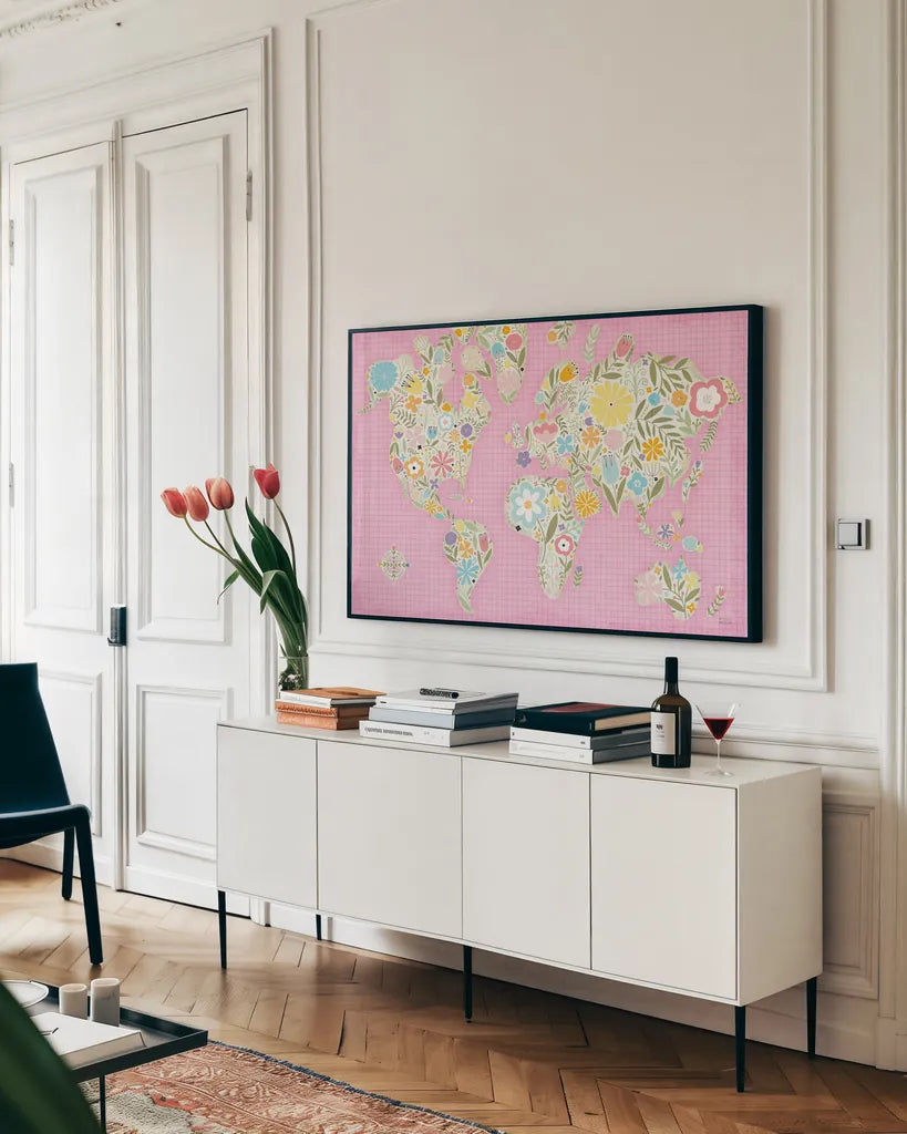Floral World Pink by Michael Mullan. shown as a framed stretched canvas in a living room above a console. Available as a archival giclee rolled canvas, fine art paper, or poster print. SKU 49367i.
