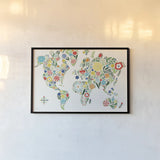 Floral World White by Michael Mullan. shown as a paper print in a black flame. Available as a archival giclee rolled canvas, fine art paper, or poster print. SKU 25721i.