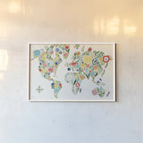 Floral World White by Michael Mullan. shown as a paper print in a white frame. Available as a archival giclee rolled canvas, fine art paper, or poster print. SKU 25721i.