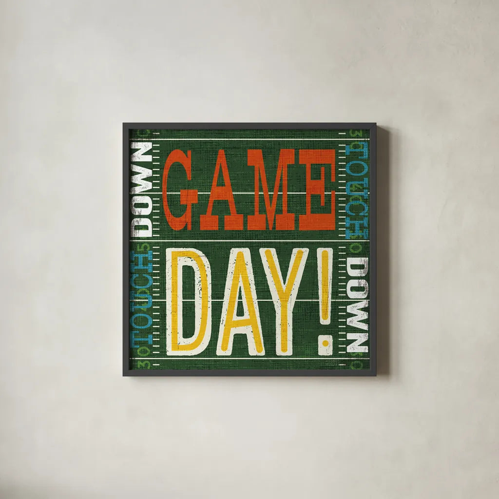 Football II by Michael Mullan. Shown in a sleek black glass frame for a contemporary gallery look. Available as an archival giclee rolled canvas, fine art paper, or poster print. SKU 61614a.