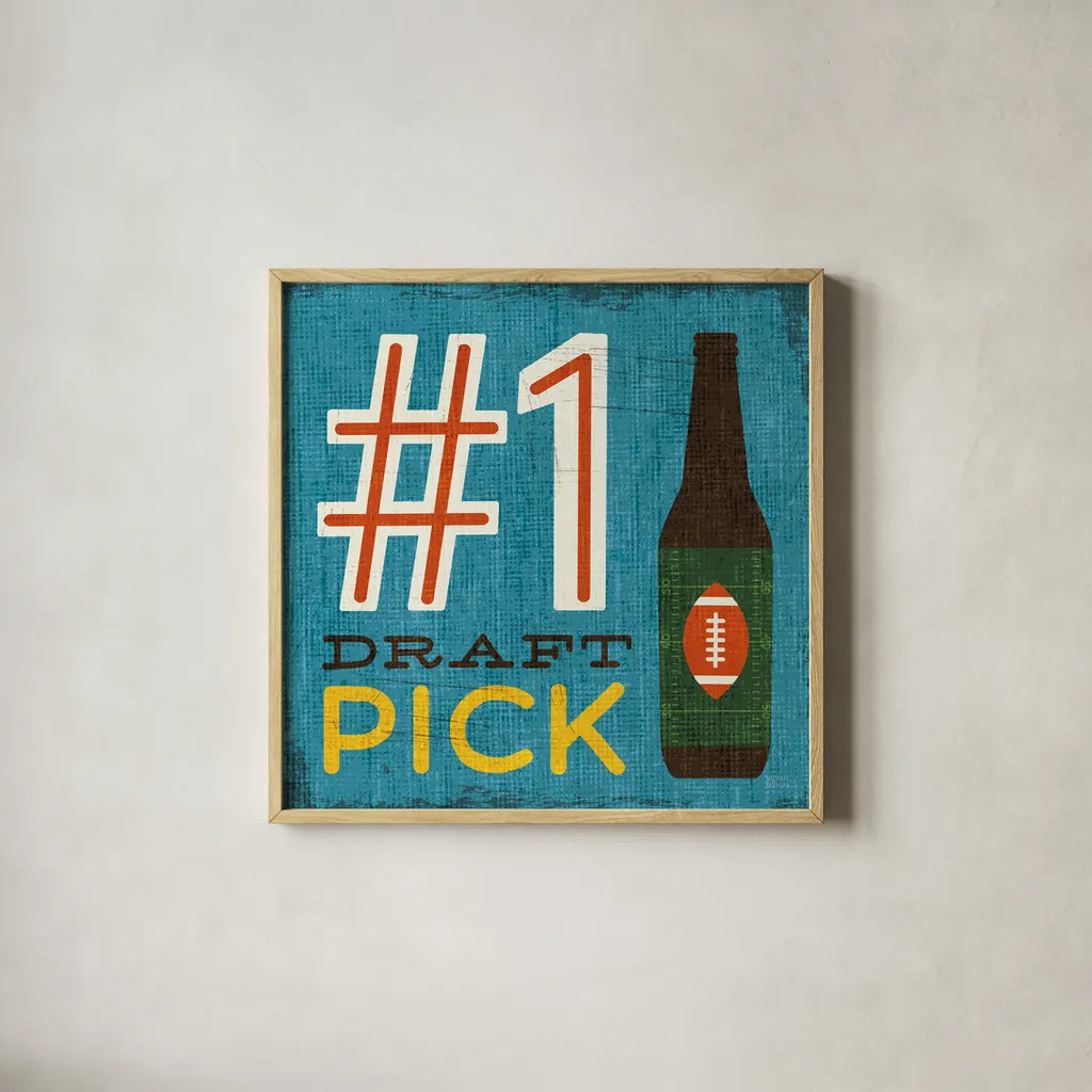 Football III by Michael Mullan. Shown in a natural wood glass frame for a timeless modern aesthetic. Available as an archival giclee rolled canvas, fine art paper, or poster print. SKU 17537a.