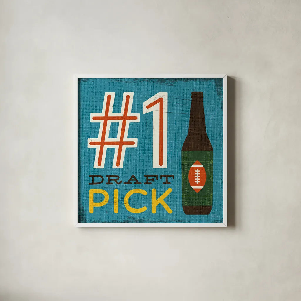 Football III by Michael Mullan. Shown in a crisp white glass frame for a clean and minimalist style. Available as an archival giclee rolled canvas, fine art paper, or poster print. SKU 17537a.