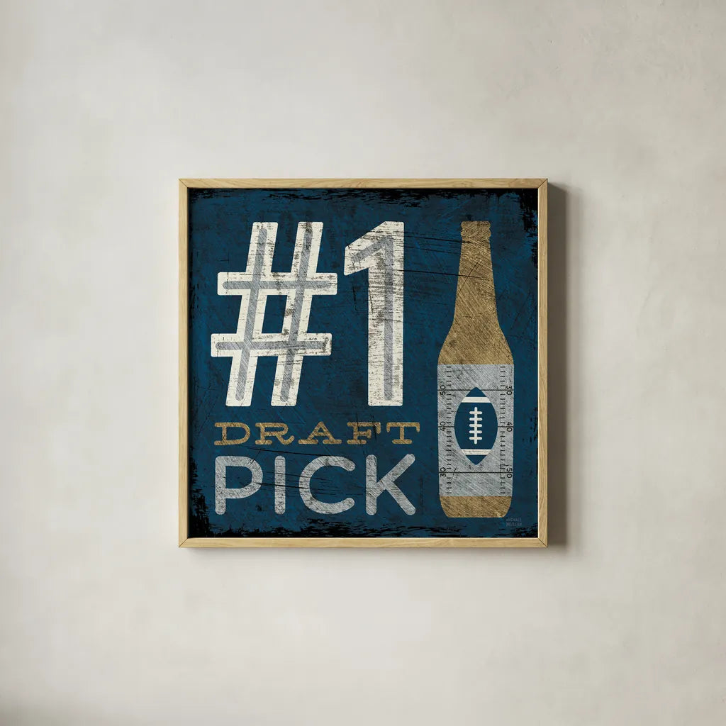 Football III Blue by Michael Mullan. Shown in a natural wood glass frame for a timeless modern aesthetic. Available as an archival giclee rolled canvas, fine art paper, or poster print. SKU 20348a.