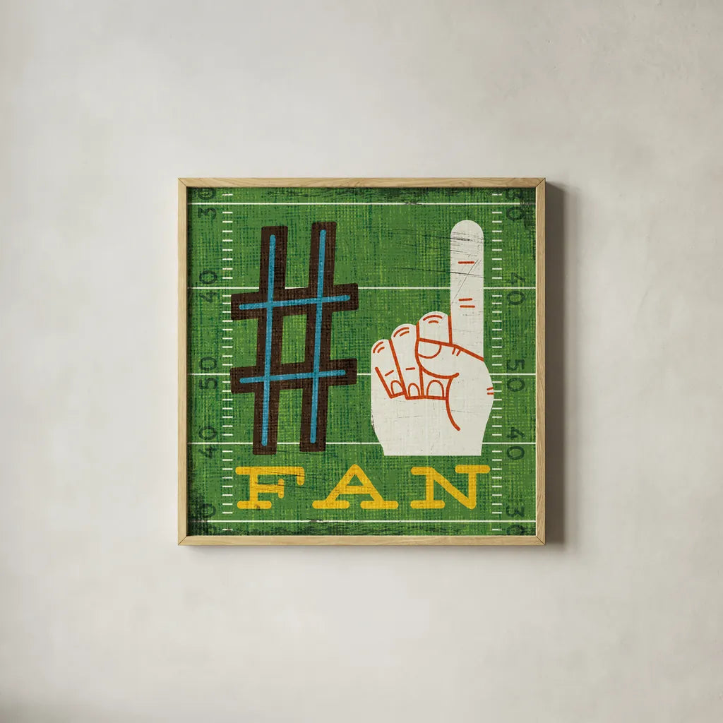 Football IV by Michael Mullan. Shown in a natural wood glass frame for a timeless modern aesthetic. Available as an archival giclee rolled canvas, fine art paper, or poster print. SKU 20344a.