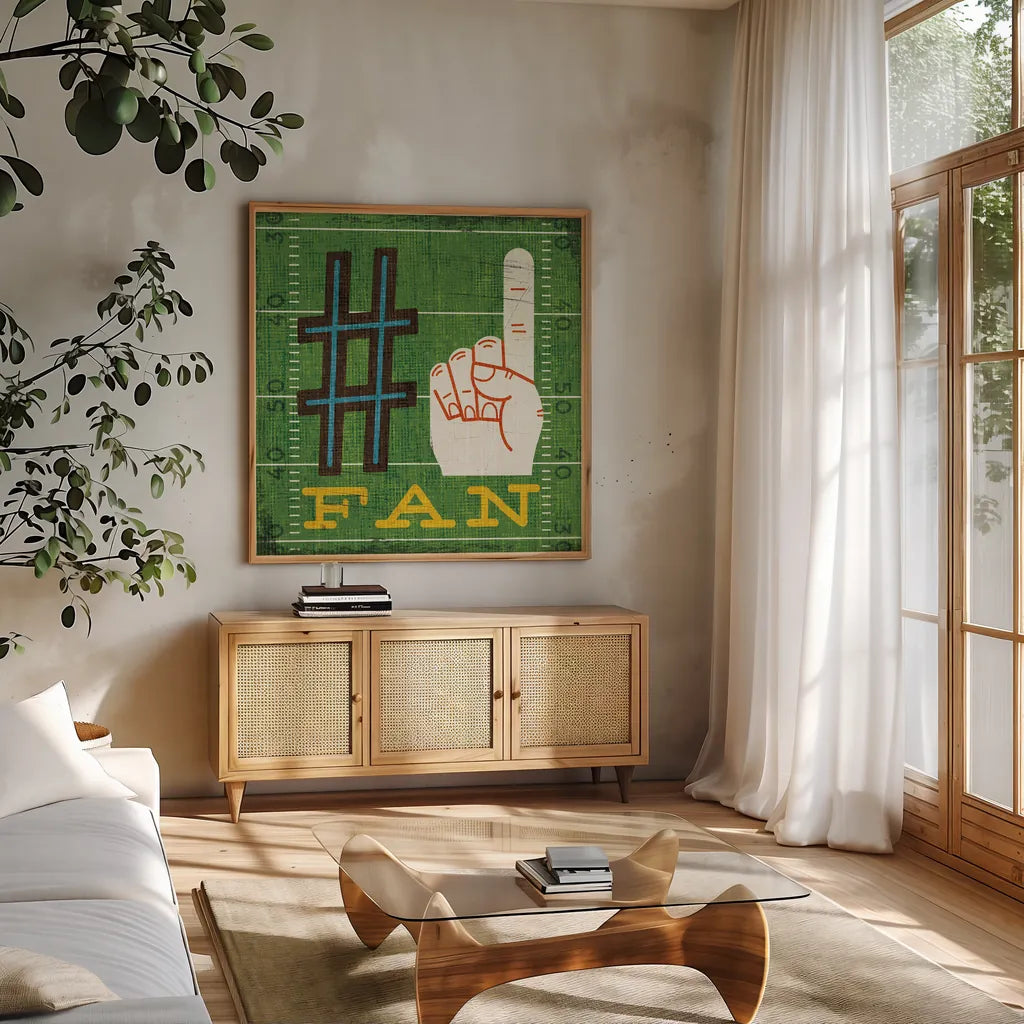 Football IV by Michael Mullan. Shown in a natural wood frame in a cozy modern living room. Available as an archival giclee rolled canvas, fine art paper, or poster print. SKU 20344a.