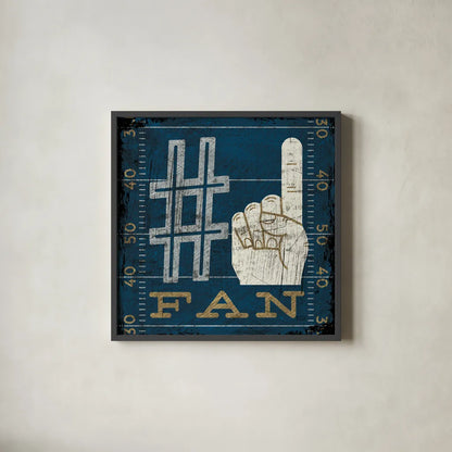 Football IV Blue by Michael Mullan. Shown in a sleek black glass frame for a contemporary gallery look. Available as an archival giclee rolled canvas, fine art paper, or poster print. SKU 20349a.