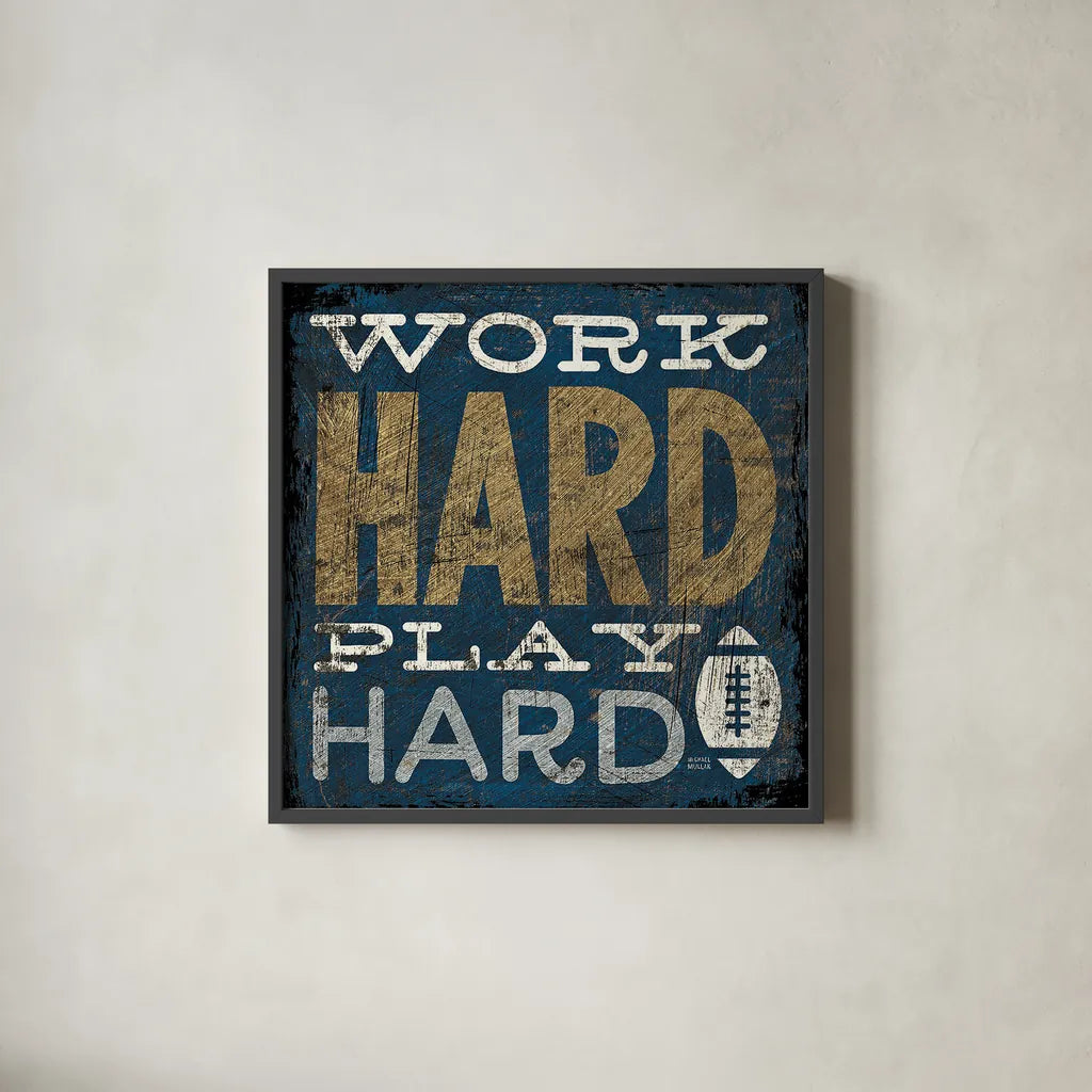 Football V Blue by Michael Mullan. Shown in a sleek black glass frame for a contemporary gallery look. Available as an archival giclee rolled canvas, fine art paper, or poster print. SKU 20350a.