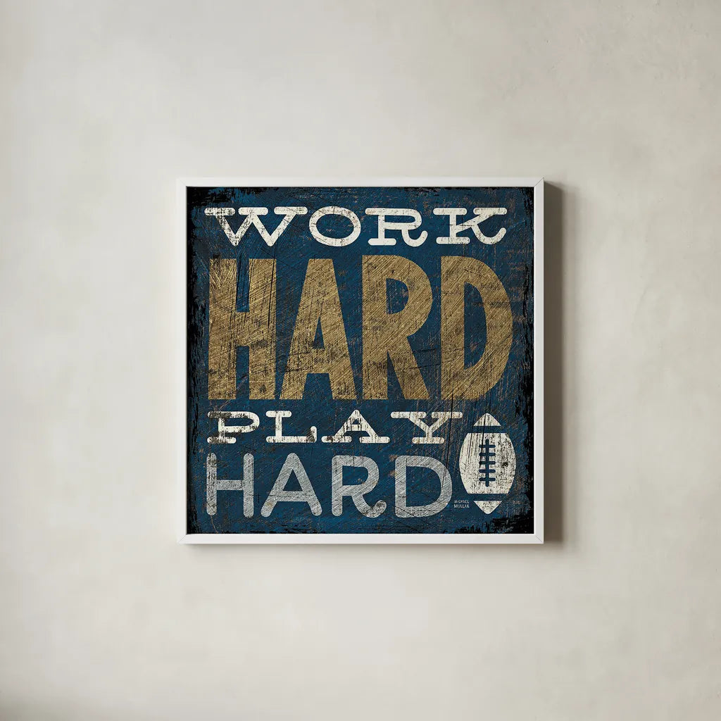 Football V Blue by Michael Mullan. Shown in a crisp white glass frame for a clean and minimalist style. Available as an archival giclee rolled canvas, fine art paper, or poster print. SKU 20350a.